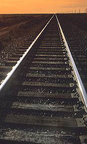 Railroad tracks converge at sunset. railroad, tracks, converge, converging, transportation, train, sunset, rail, ties, infinity