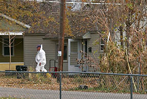 Investigators at scene of explosive discovery. --JAKE MERRILL photo