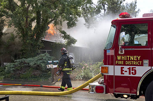 Firefighters battled heat from the sun and the flames Wednesday during a three-alarm blaze east of Boise.