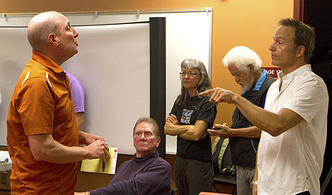 Elliot Werk (left) confronted meeting organizer Henry Weibe over a noise stunt.